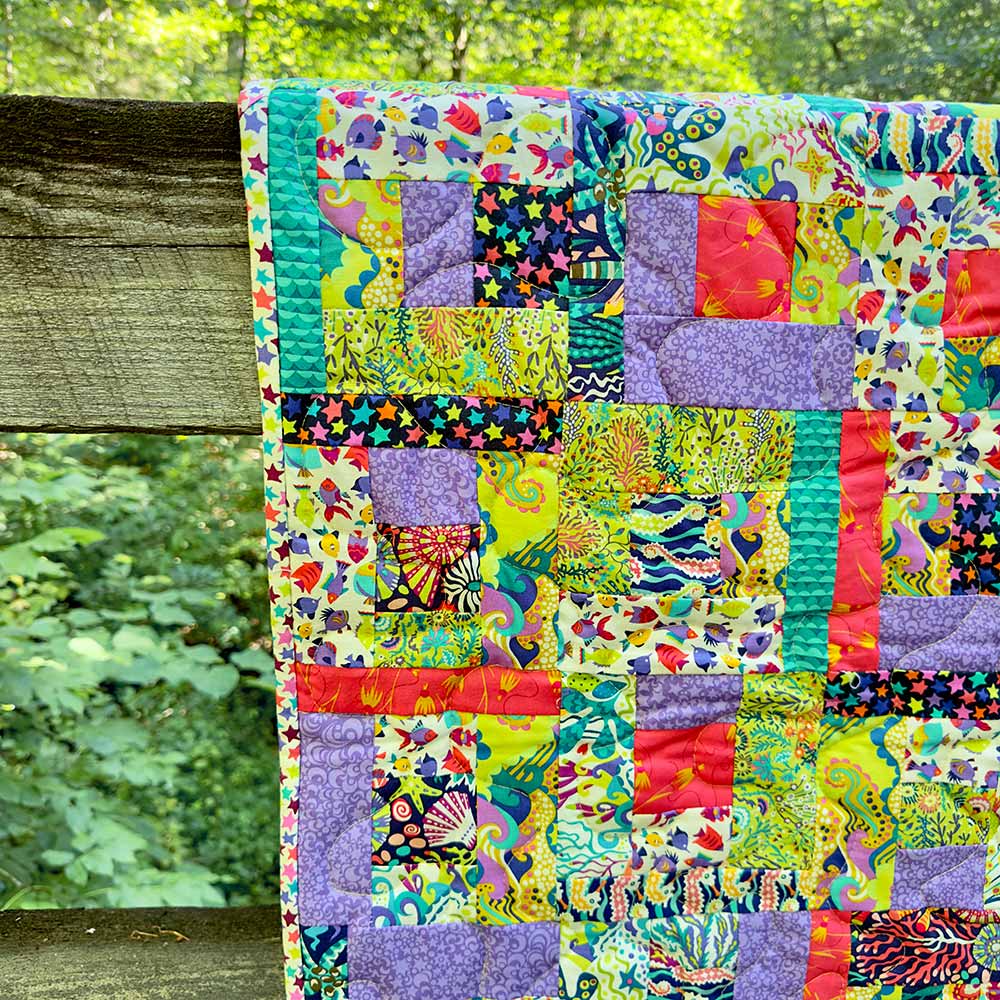 Scrappy Crumb Rail Quilt: An Exciting 2.5 Strips/Jelly Roll Pattern