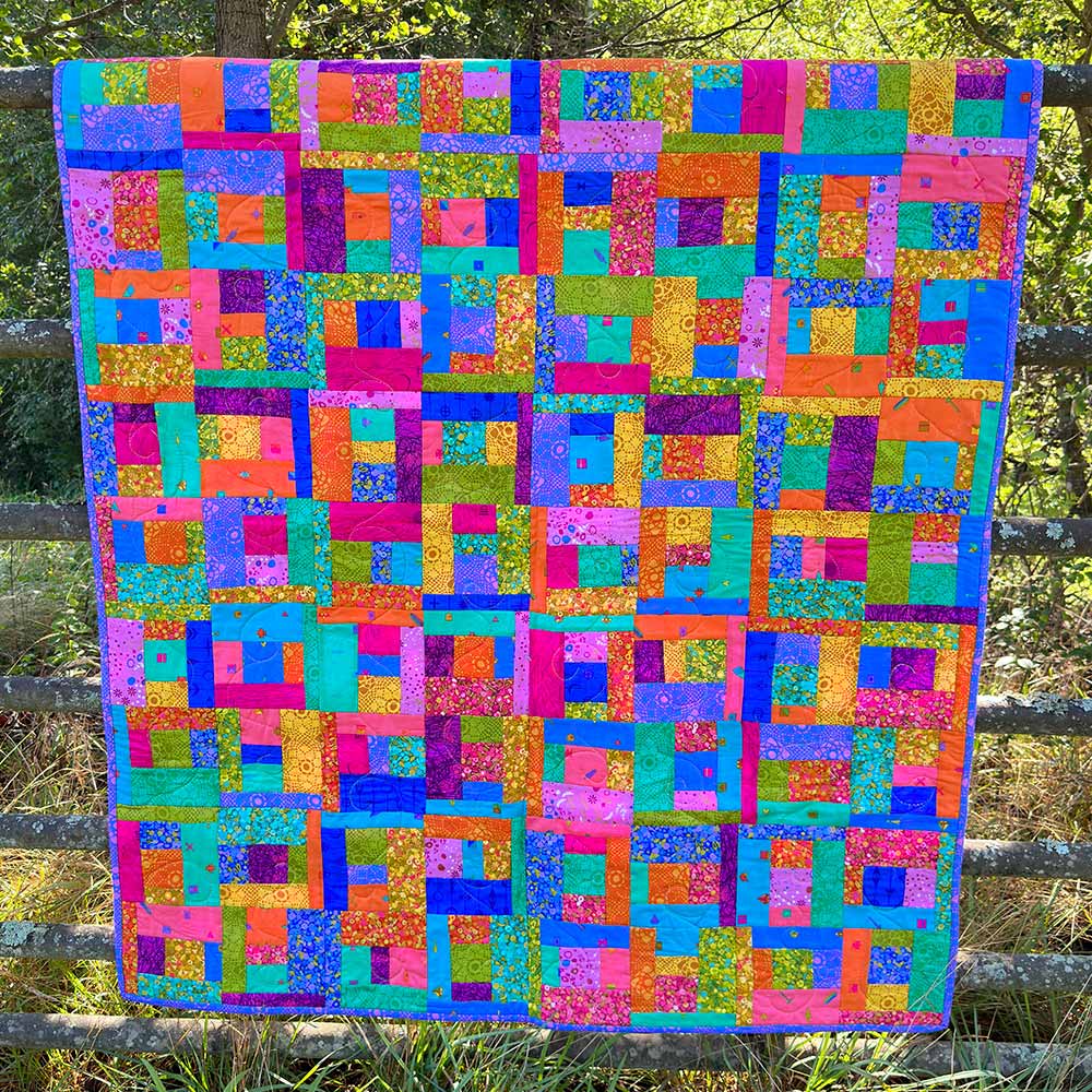Scrappy Crumb Rail Quilt: An Exciting 2.5 Strips/Jelly Roll Pattern